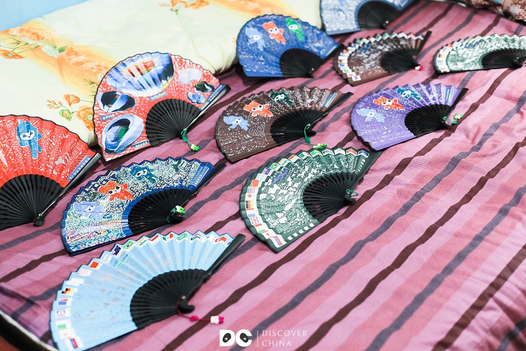 Discover China - 🔖 #Hangzhou's paper-cutting #fans are a... | Facebook