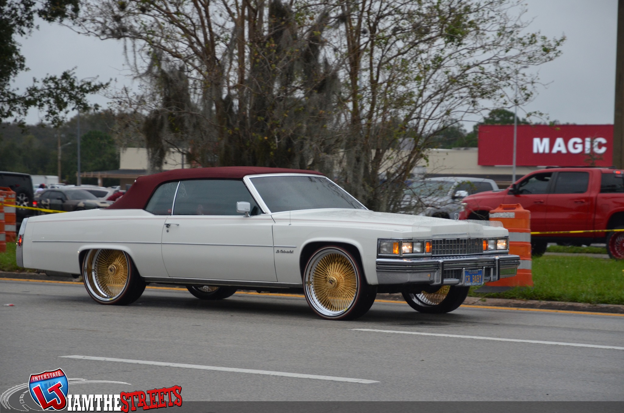 Kandy teal cadillac le cabriolet on gold Dayton wire wheels