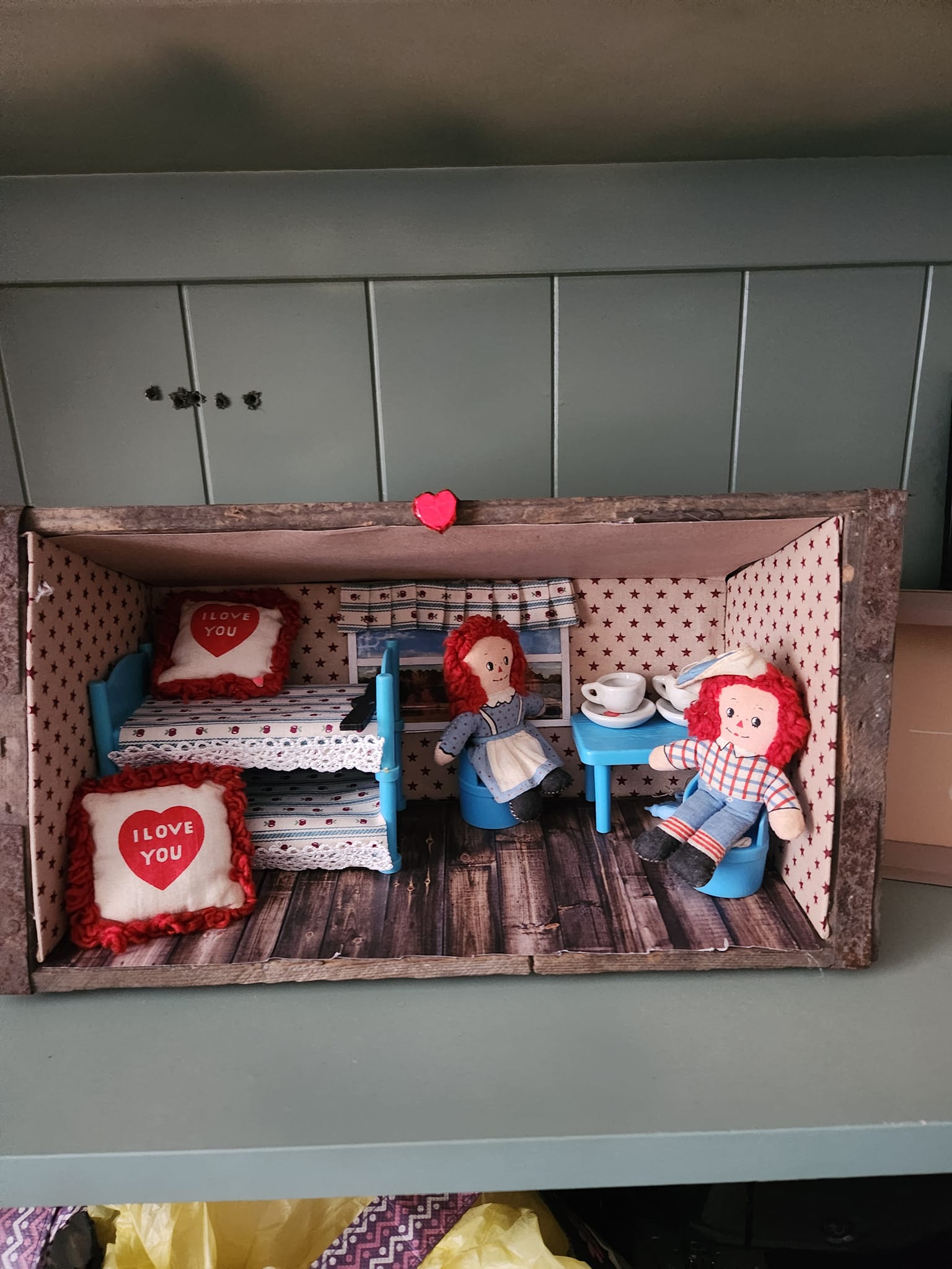 Raggedy Ann and Andy's Christmas house in a miniatures setting