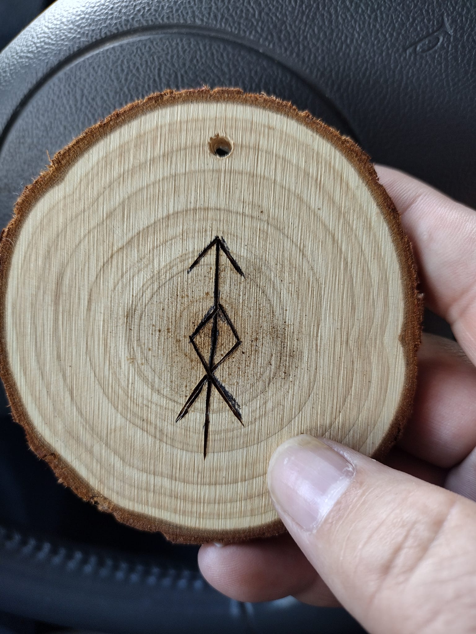 Any meaning behind the mjolnir rune?