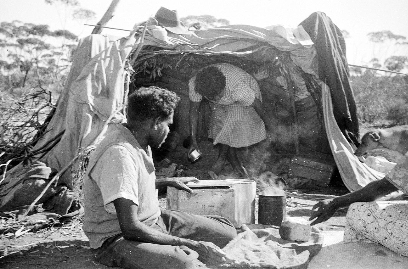 State - 130446PD: A man and woman in a humpy at the Cundeelee camp with ...