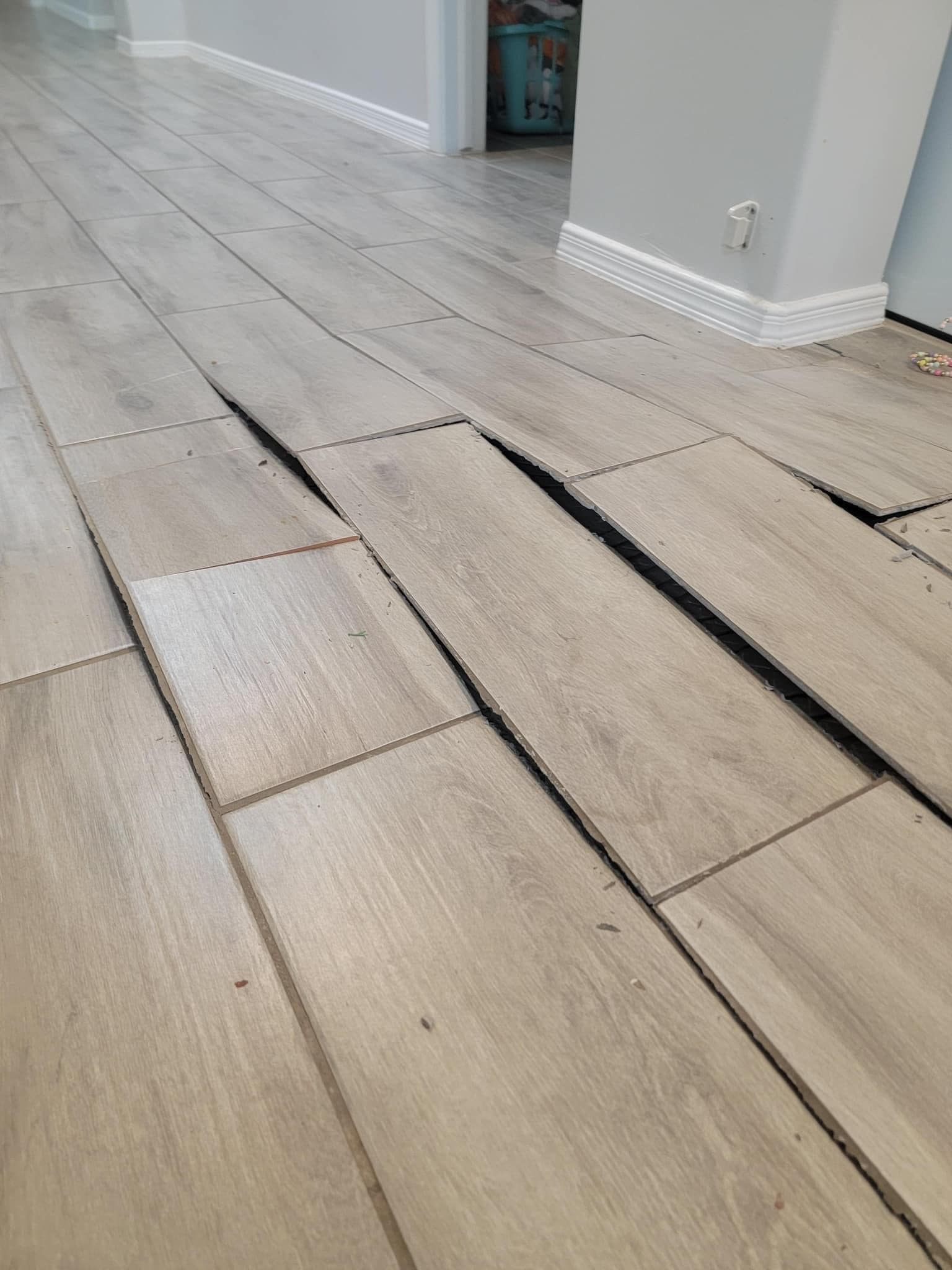705contracting - What causes ceramic tile to buckle 🤔 #tile #flooring # ...