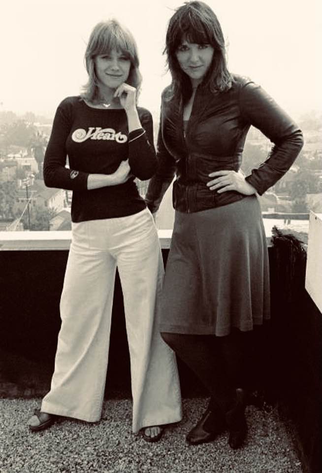 Nancy Wilson and Ann Wilson pose on Hollywood, CA rooftop