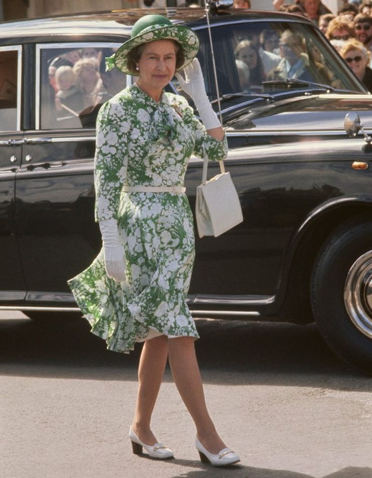 Queen Elizabeth II in 1977, wearing a green-and-white floral pattern dress with a green-and-white hat, during a walkabout in New Plymouth, New Zealand. Historical Haven