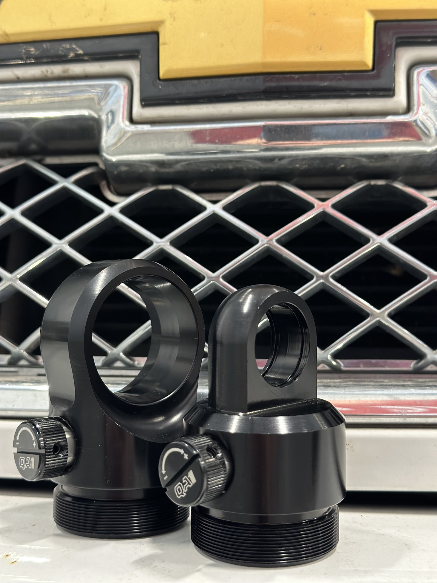 QA1 - Pictured on the right is our standard shock base. On...