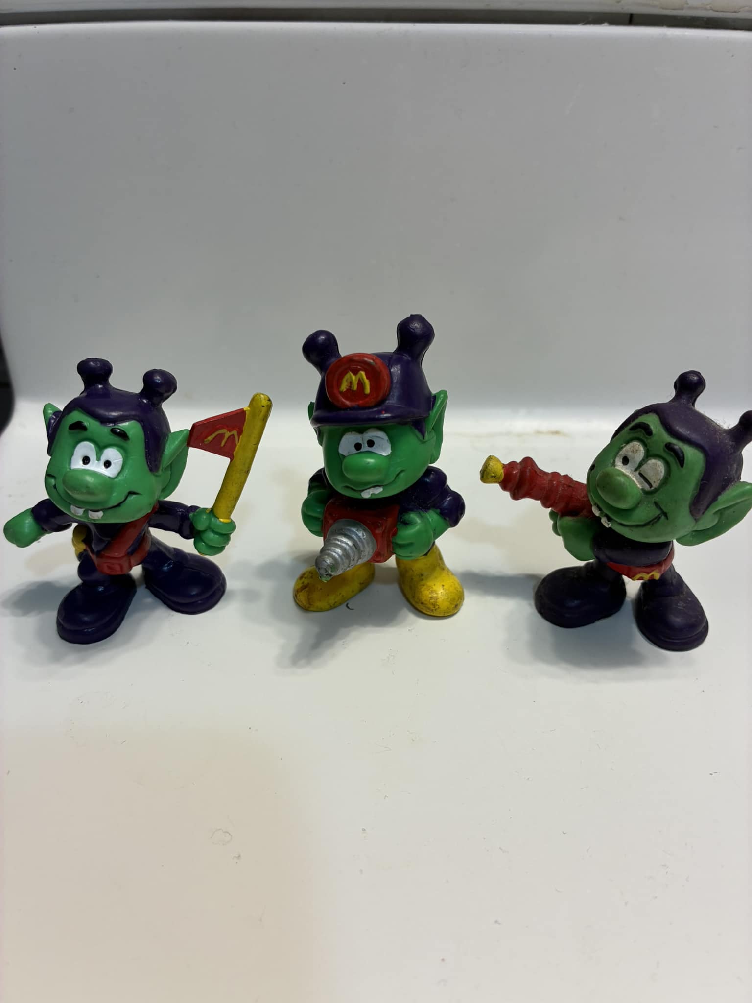 Vintage McDonald's toys with Smurfs and California Raisins