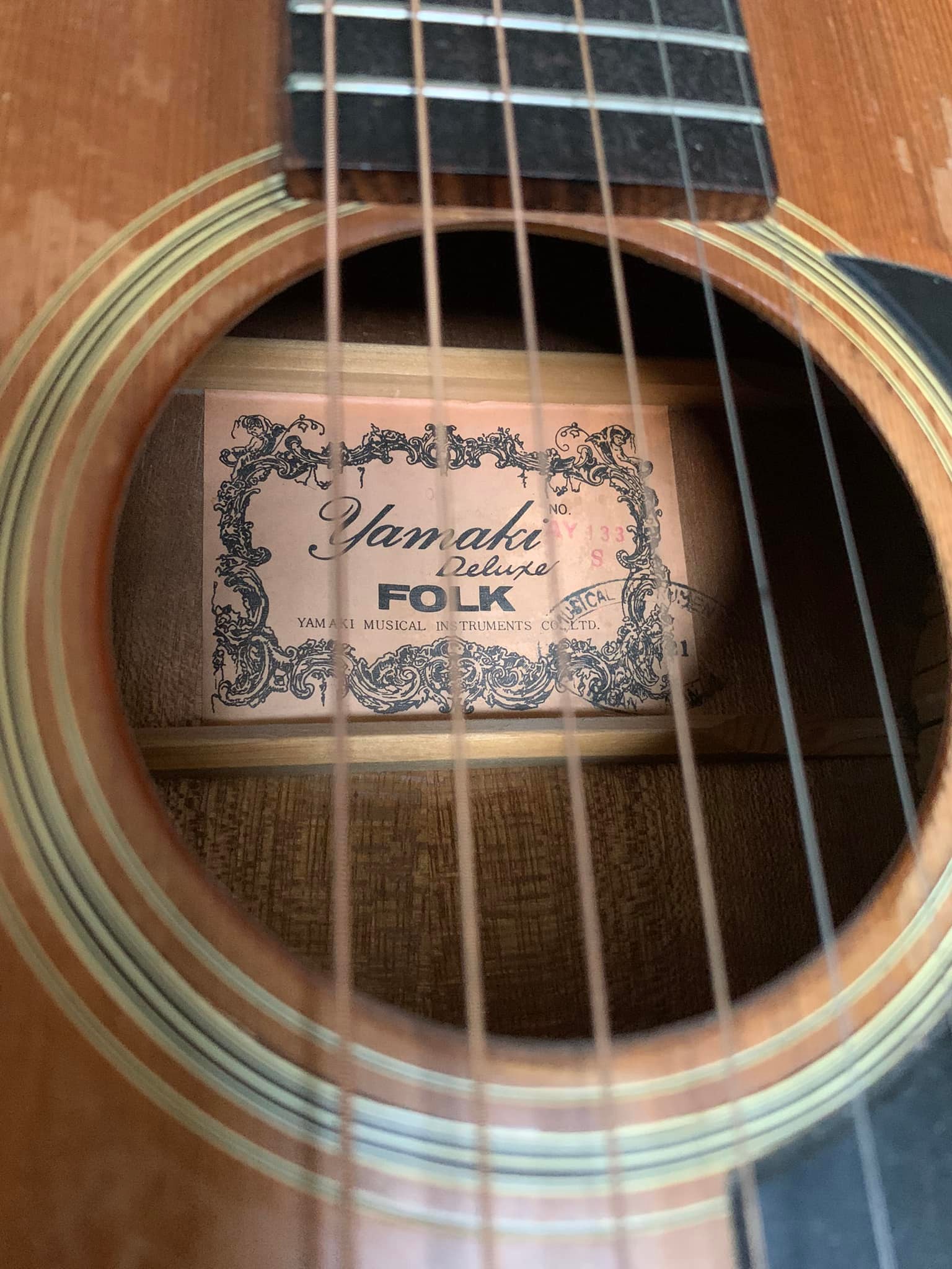 Is there a 1970s Yamaki cedar top guitar with same inlays?
