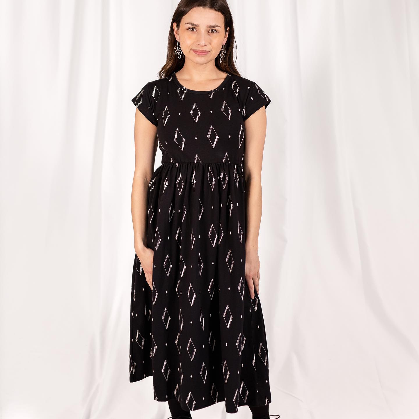 shea organic cotton swirl knit dress The is crafted from a soft mid-weight blend of cotton and nylon, offering a comfortable yet elevated feel. Online now look-nivali-off-shoulder-top-olive