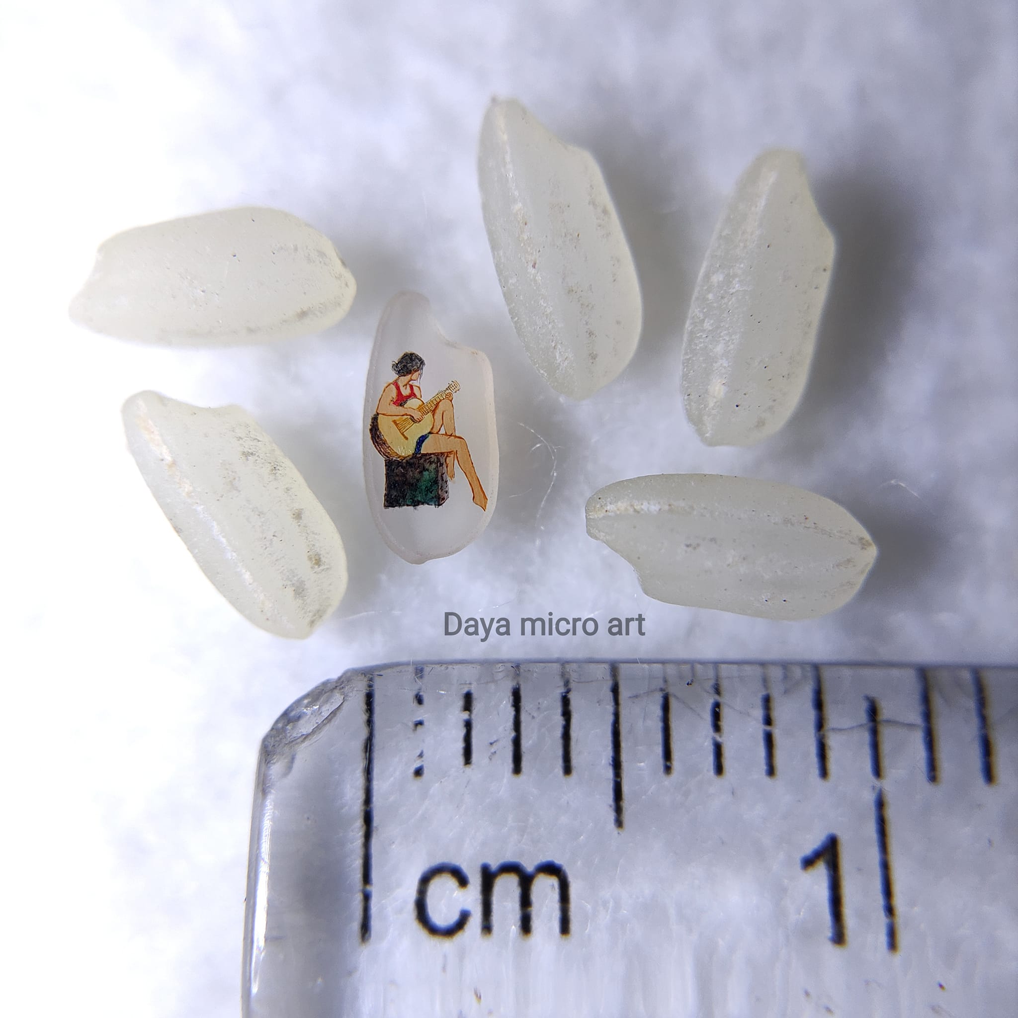 Daya Micro Art - How is this tiny painting on a grain of...