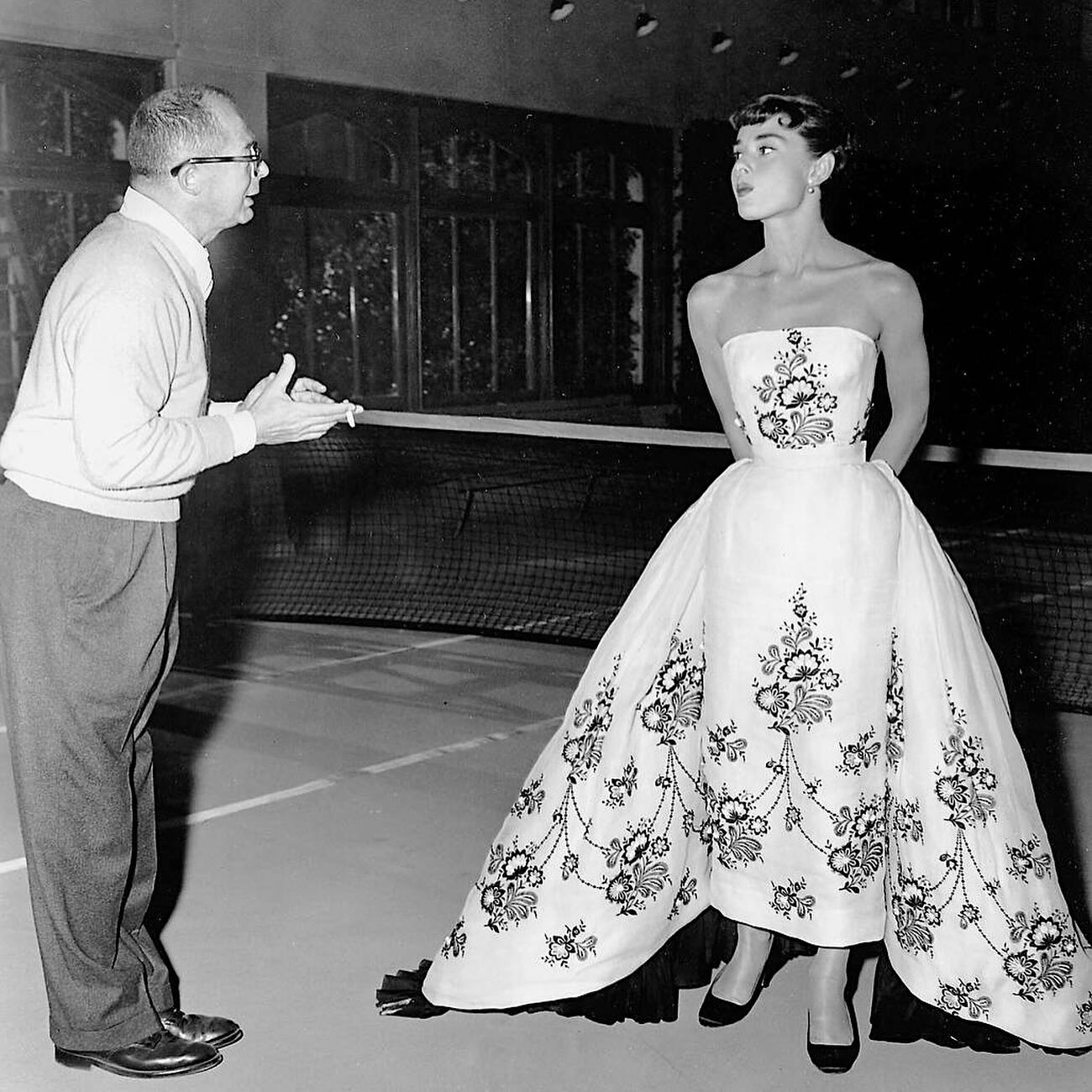 sabrina carpenter black and white dress honoured the classic 1954 film Sabrina, featuring Audrey Hepburn, by wearing a stunning made from actual film strips, embellished with rhinestones crowned with a dazzling headpiece, telling a cinematic Style:Dress Return of the Dollz sachin_core