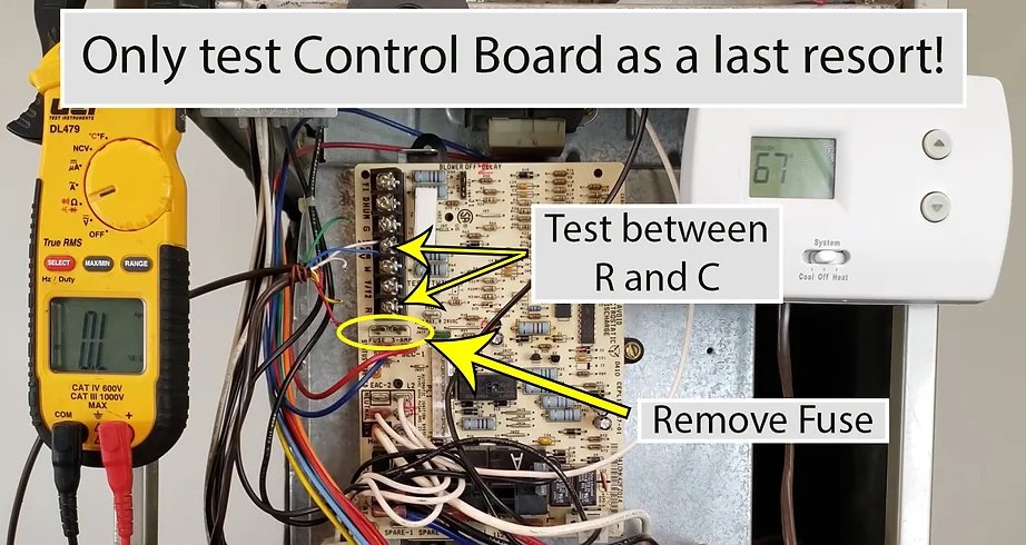 HVAC technician testing control board transformer and checking 24V electrical continuity with digital multimeter in Canton OH
