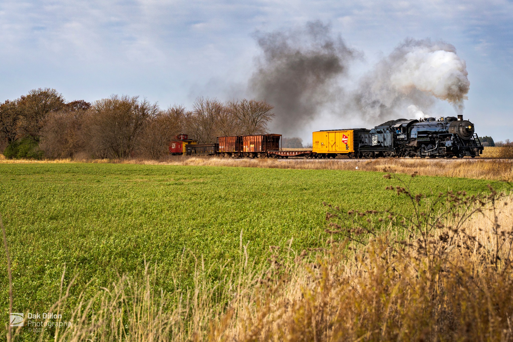 Dak - Soo Line 1003 works southbound. Soo Line 1003 is a 2-8-2 Mikado ...