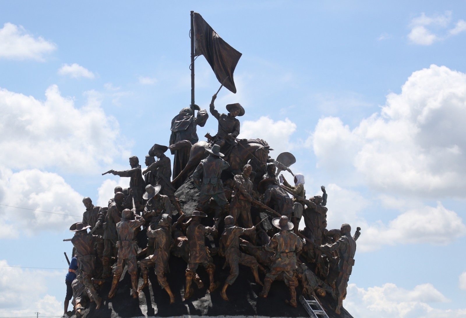 MANILA BULLETIN - LOOK: A worker paints the newly...