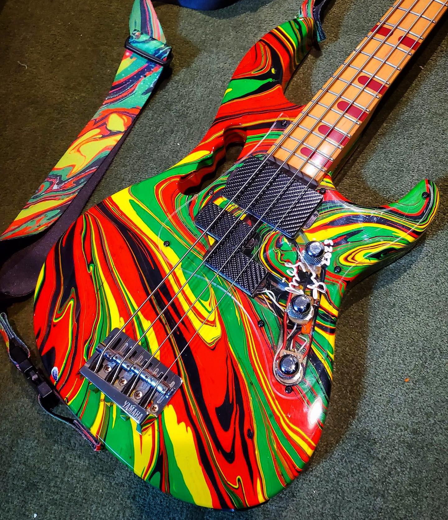 Yamaha Attitude basses customized with Monkey Grip and swirl paint