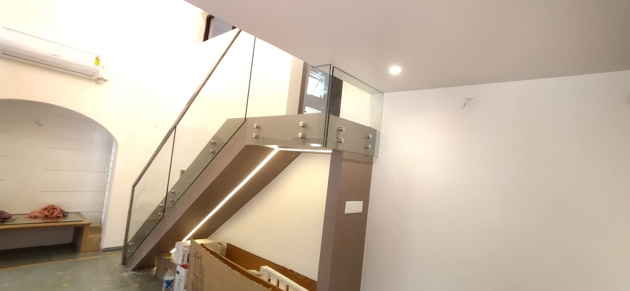A frameless glass railing provides... - Ekvira Glass Railing