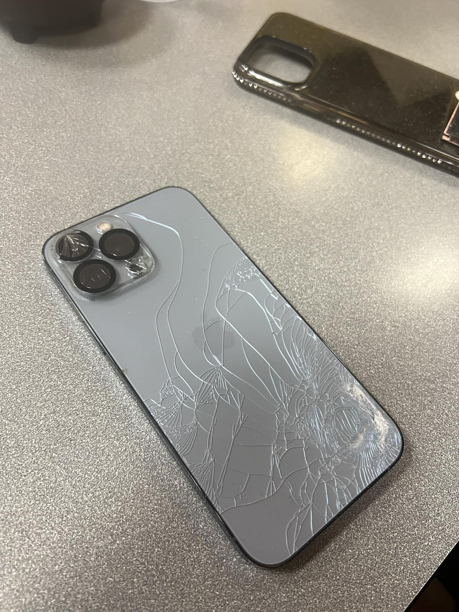 I phone 13 pro max cracked only at the back cover