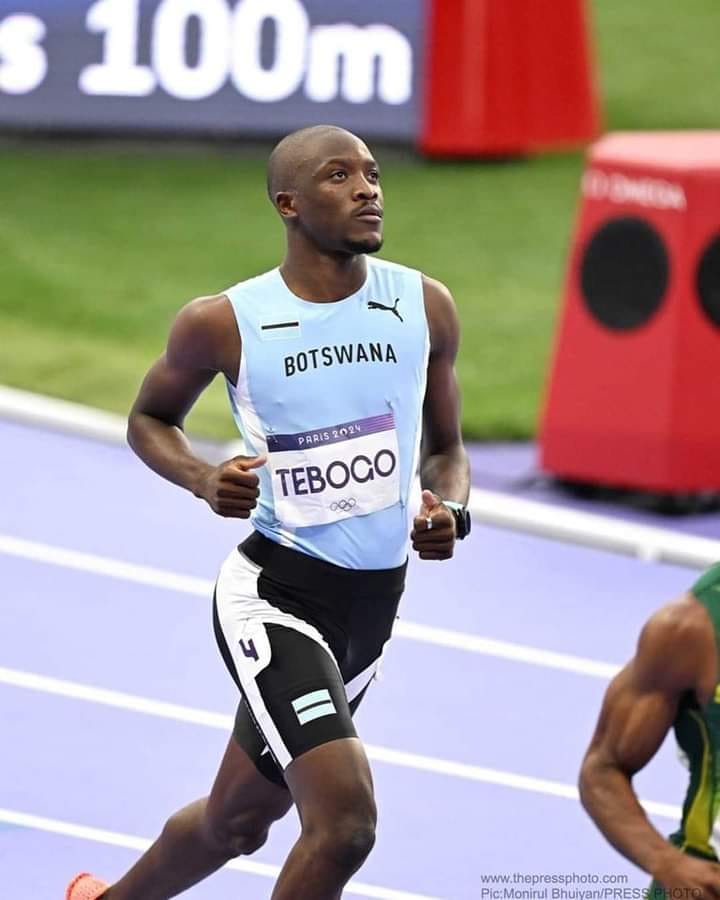 track runner with yugioh card Trackblack - GFP2-EN028 Ultra Rare Noah Lyles and his 'Yu-Gi-Oh!'