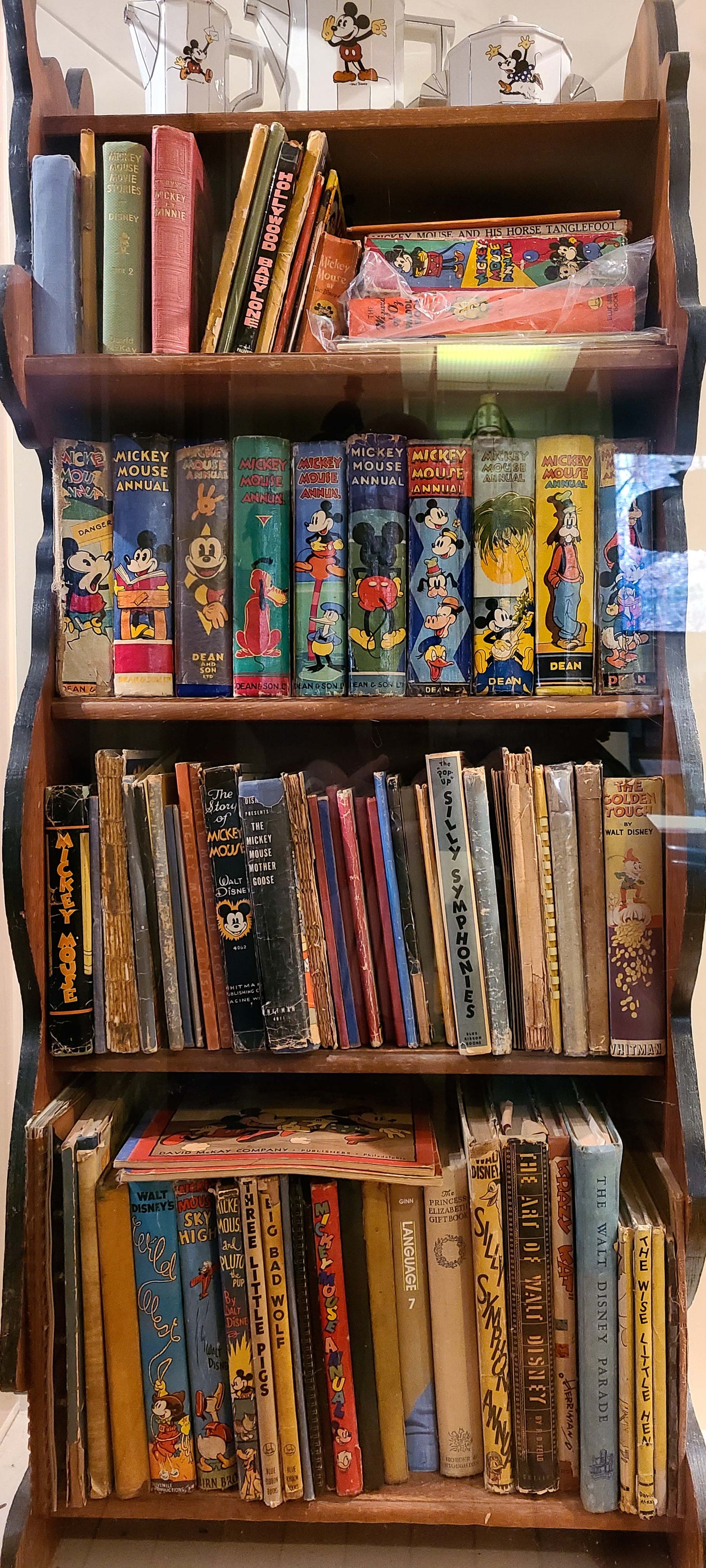 Vintage Disney bookcase and English Annuals collection