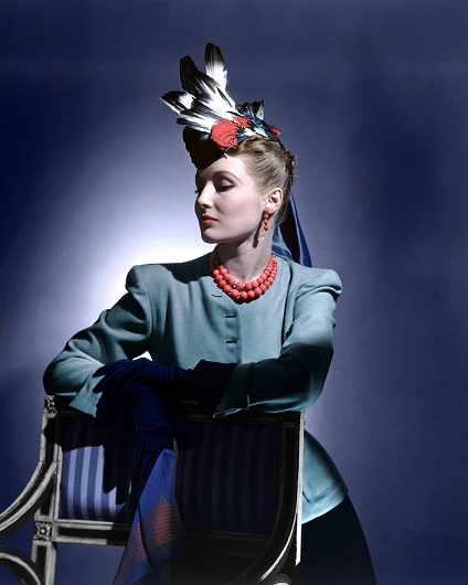 What are the details of the model's outfit in the 1938 Vogue magazine?