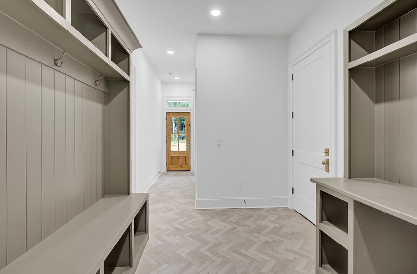 A mudroom with custom drop zone... - Goodwin Custom Homes