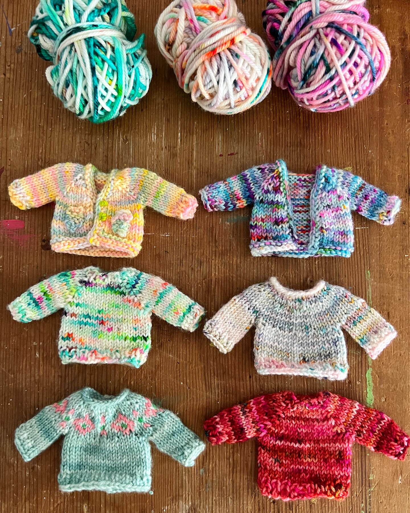 Tiny hand-knitted sweaters with 0.8mm needles and pure wool