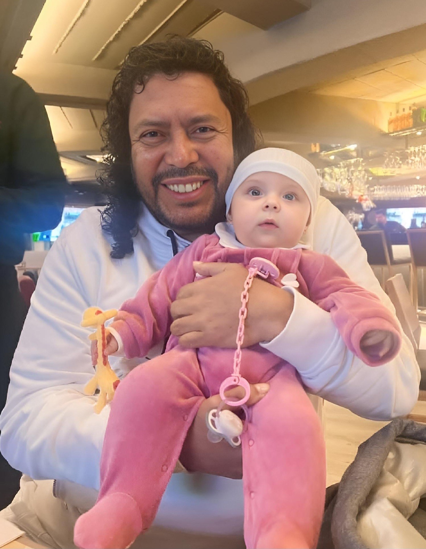 Legendary goalkeeper René Higuita with his grandchild.