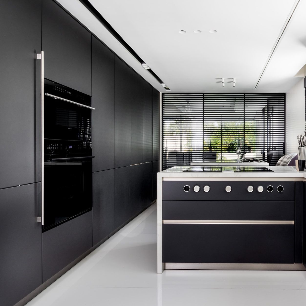 SieMatic - This modern black kitchen design, enriched with...