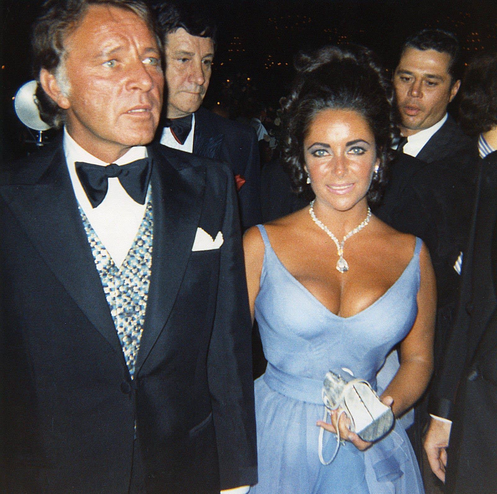 elizabeth taylor blue oscar dress and the Oscars: The 1970s 🌟 📷 Photo #1: Elizabeth and Richard attend the 42nd Academy Awards on April 7, 1970, where he was a Best Actor nominee for 