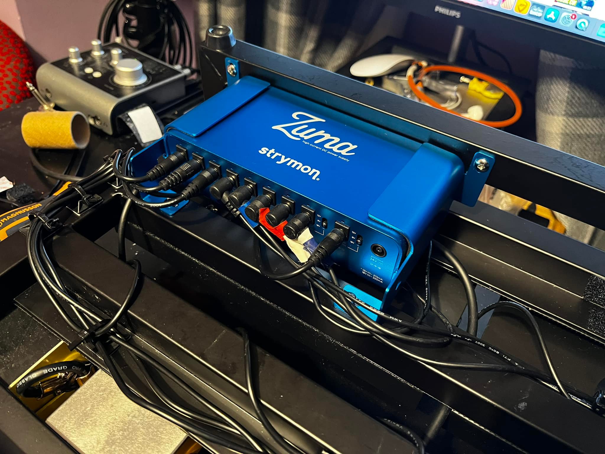 25-year-old mounts power supply to pedalboard with new drill