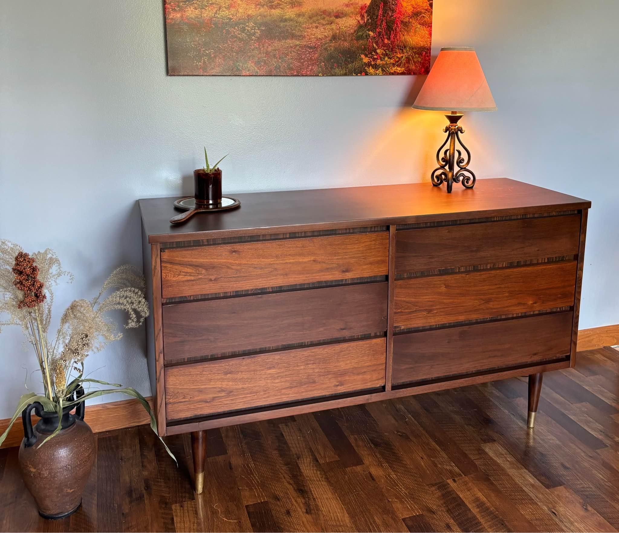 Beautiful 6-drawer dresser by Union Rustic, Holtzlander collection, in Grand Walnut finish. Excellent condition, clean and very well maintained. Spacious drawers and a modern walnut look. Approx. 60.75” W × 17.5” D × 31.1” H