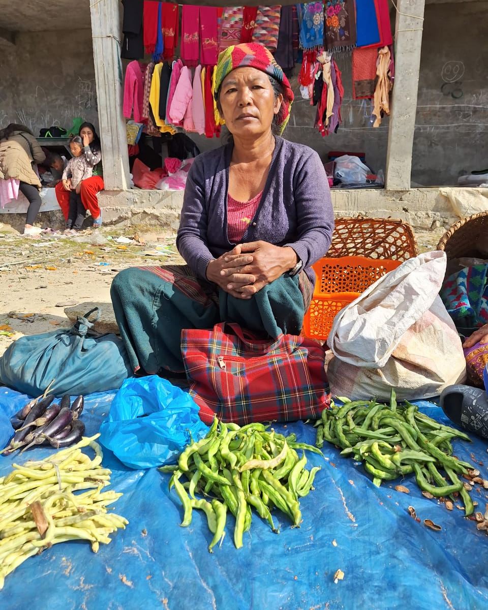 dZi Foundation - Janu Maya Rai sells beans, eggplant, and...