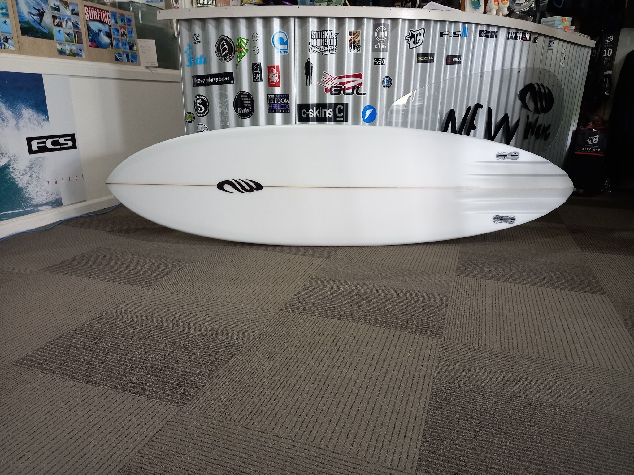 What's the ideal fin setup for a channel bottom twin surfboard?