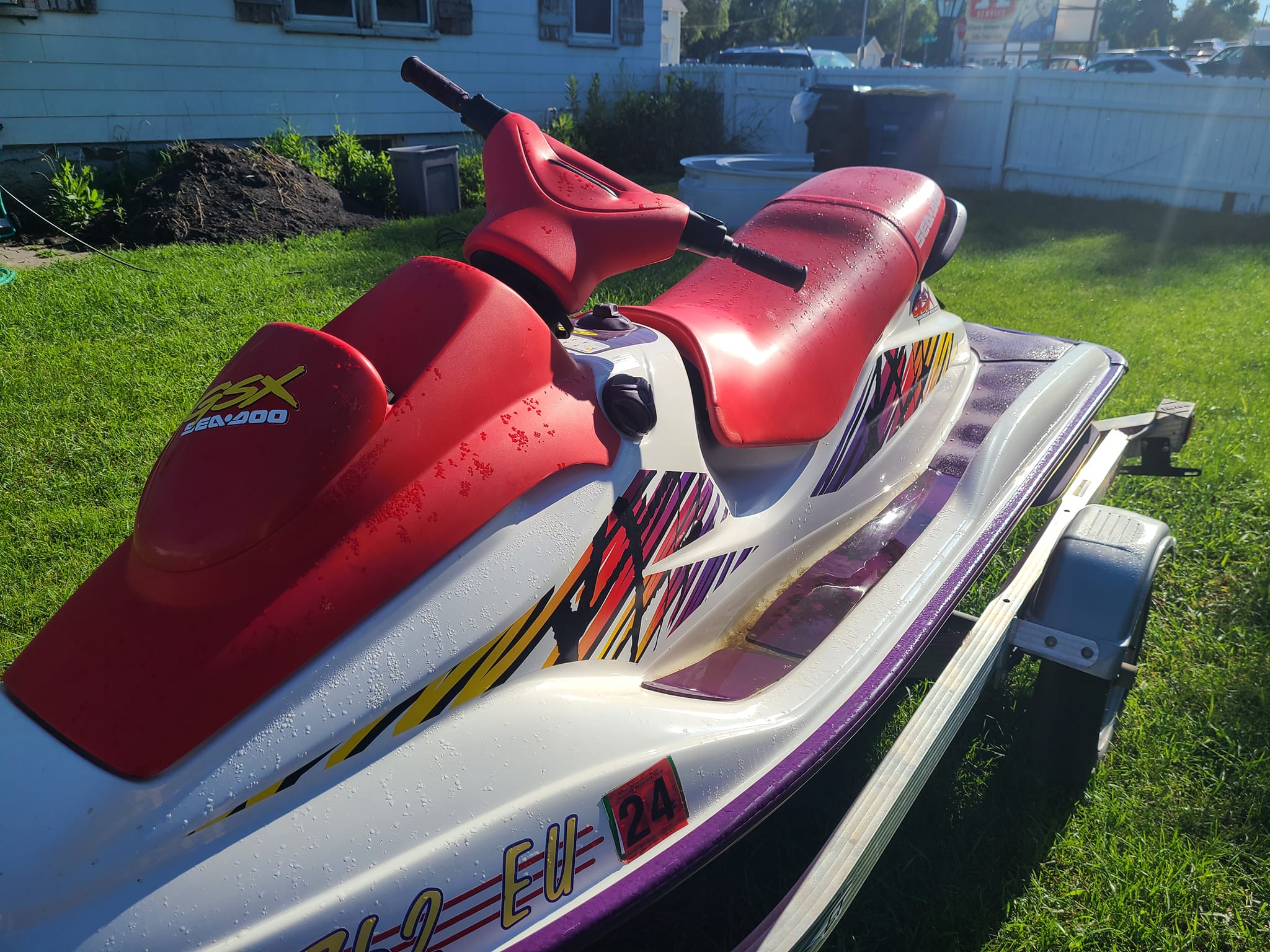 What causes surging at wide open throttle in a 717 Sea-Doo engine?