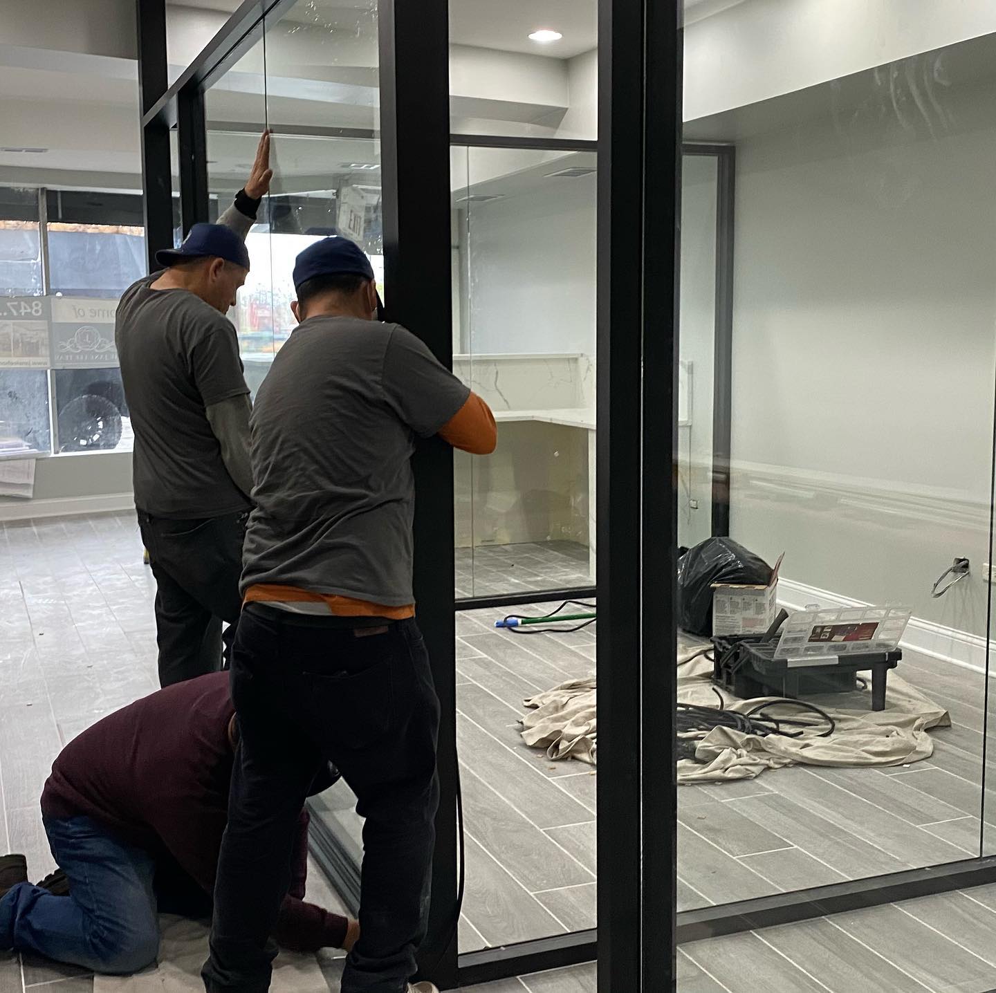 Today is the day for the glass walls... - One7 Construction | Facebook
