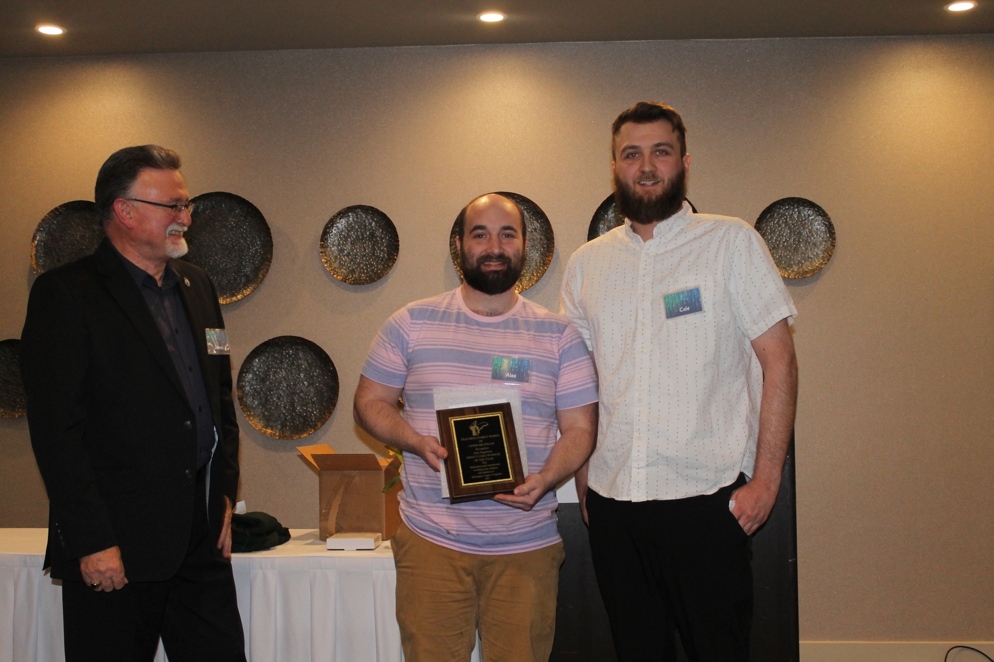 Receiving awards... - Teaching Family Homes of Upper Michigan