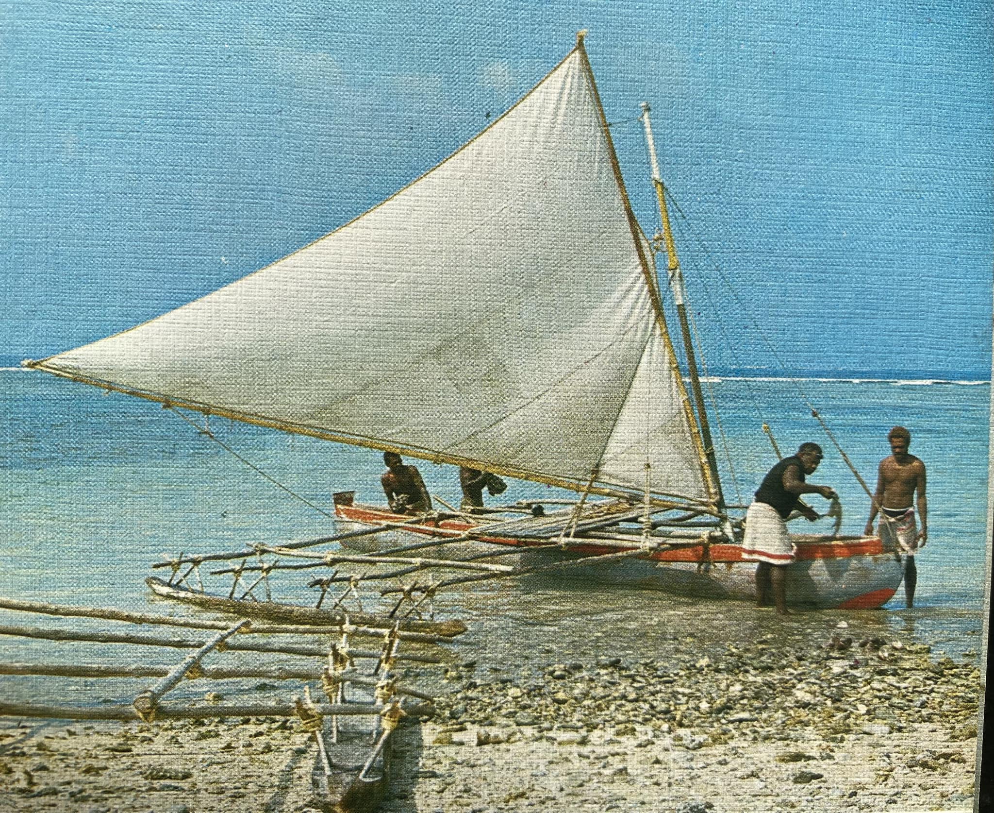 Outrigger canoe sailing in Vanuatu with historical context