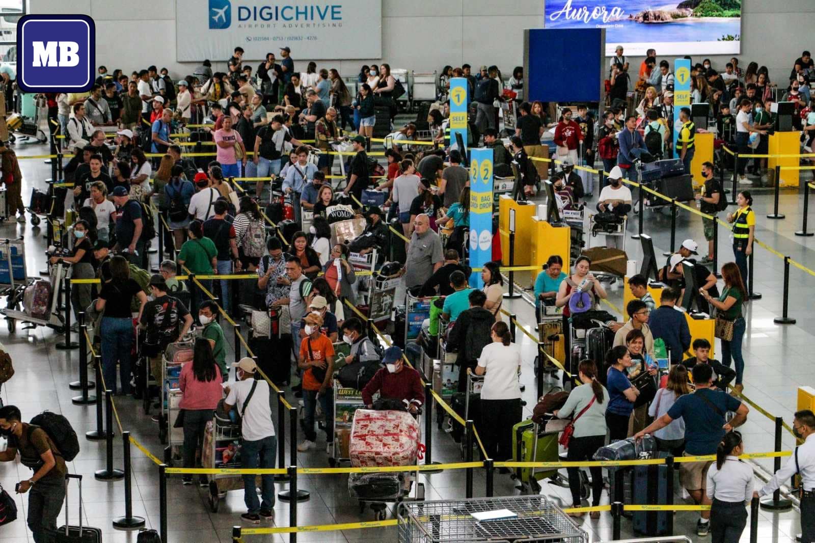 MANILA - LOOK: Long queues are seen at the check-in counters of Ninoy ...