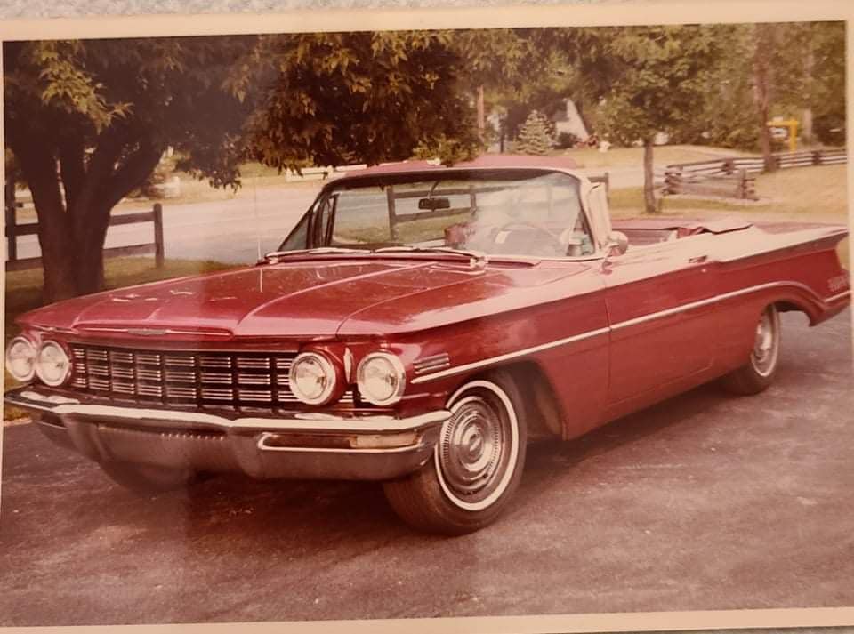 It's a garnet mist 1960 Oldsmobile Super 88 convertible originally
