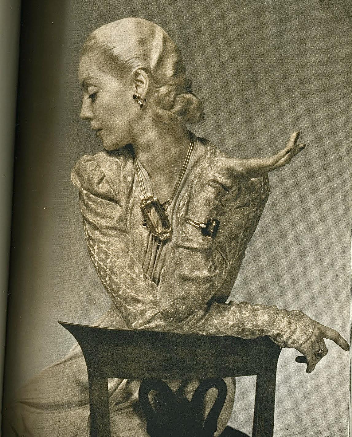 What are the details of the model's outfit in the 1938 Vogue magazine?