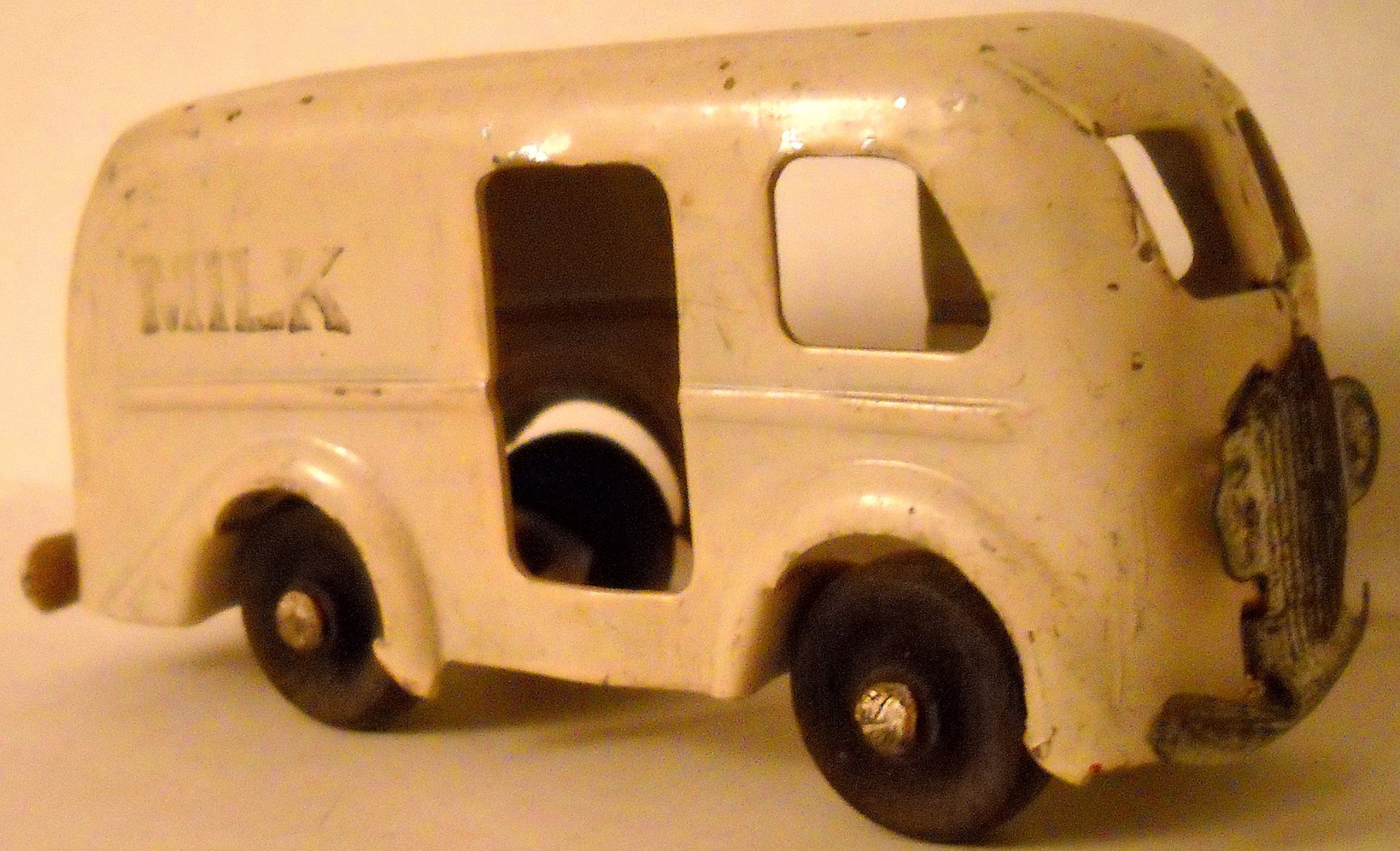 Vintage rubber milk truck toy from the 1940s