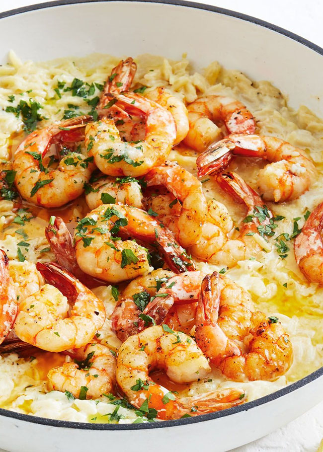 Taste.com.au - 😋 Garlic prawns on a bed of creamy risoni....