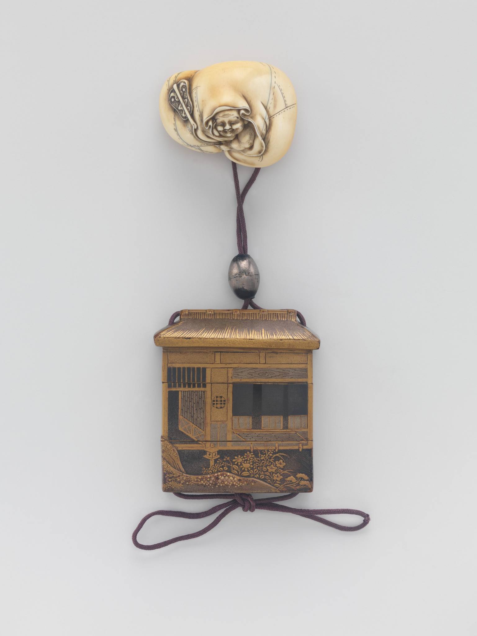 19th century Inro, silhouette design, Japan. Wood, black and gold 