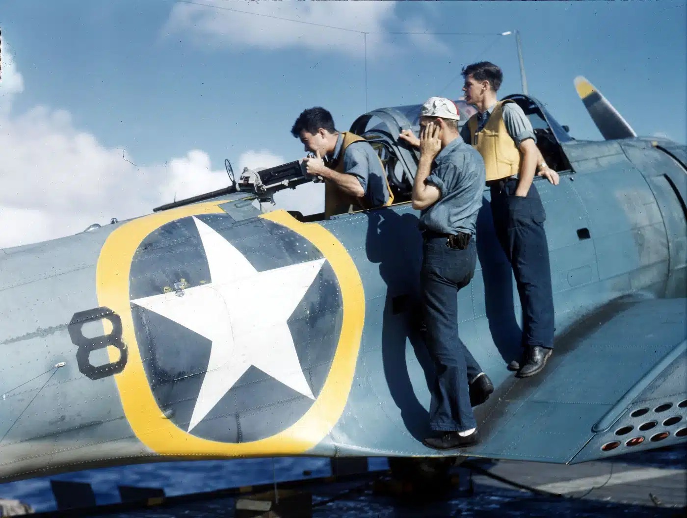 World - A radioman-gunner aboard a Douglas SBD-3 Dauntless test fires ...