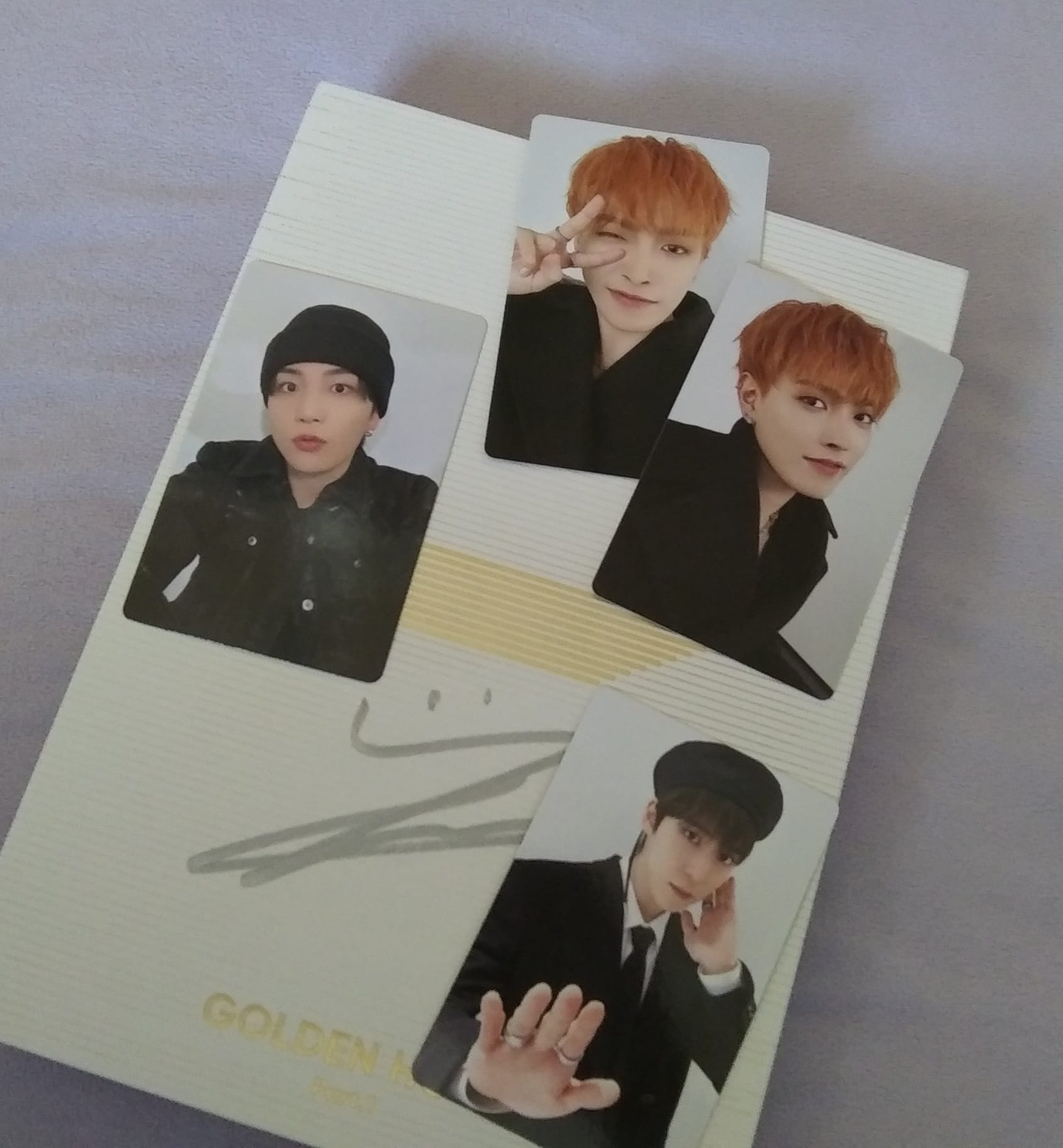 Ateez members' signatures on poster