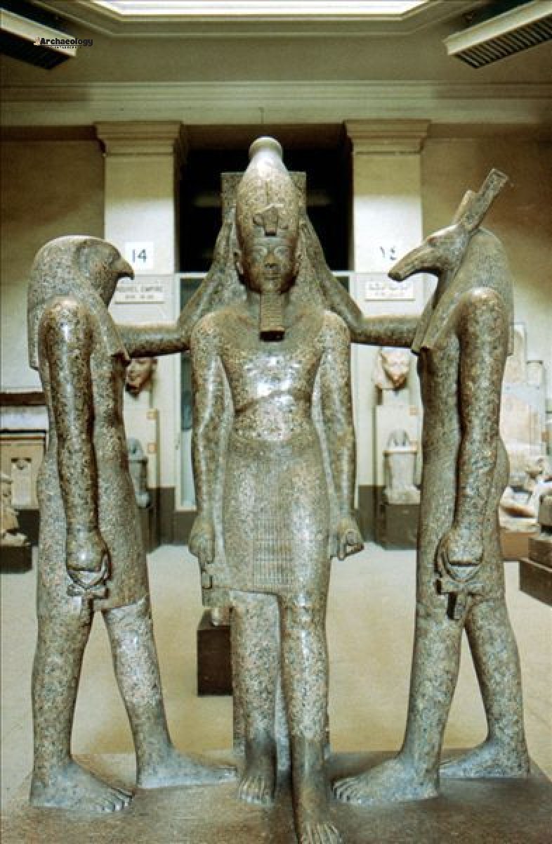 Ancient Egyptian triad statue of Ramses III with Horus and Seth