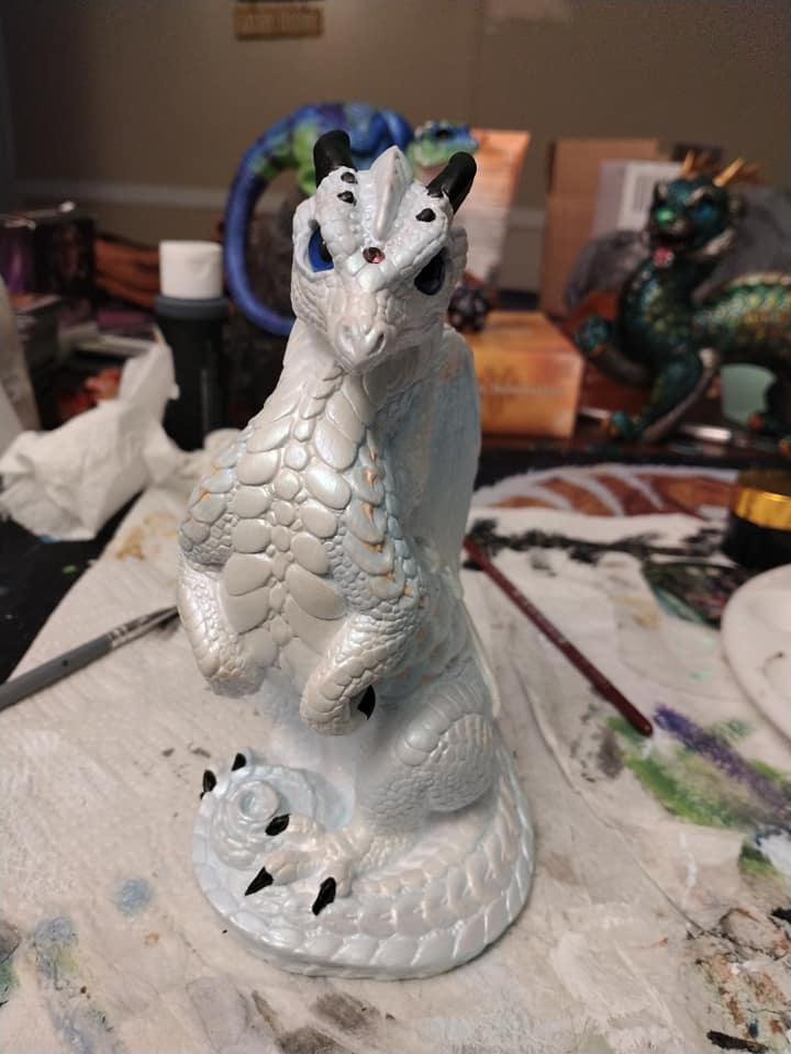 Introducing Opalite, a pale blue and white dragon