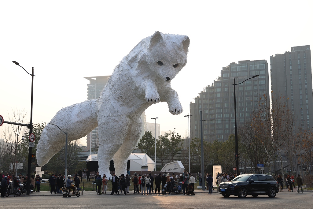 A giant installation of an Arctic fox has appeared on a Shanghai