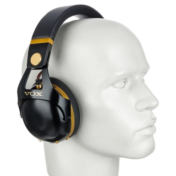 What type of headphones work with the Personal Audio Quietvox device?