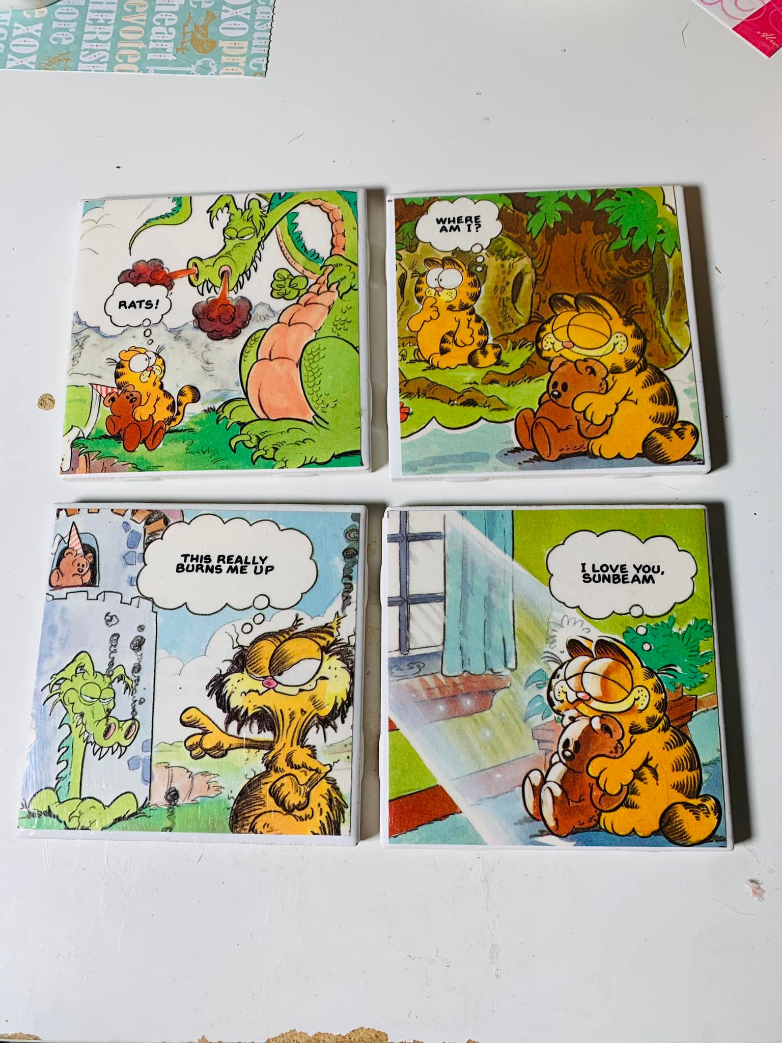 I started some coasters using pages from a vintage Garfield book