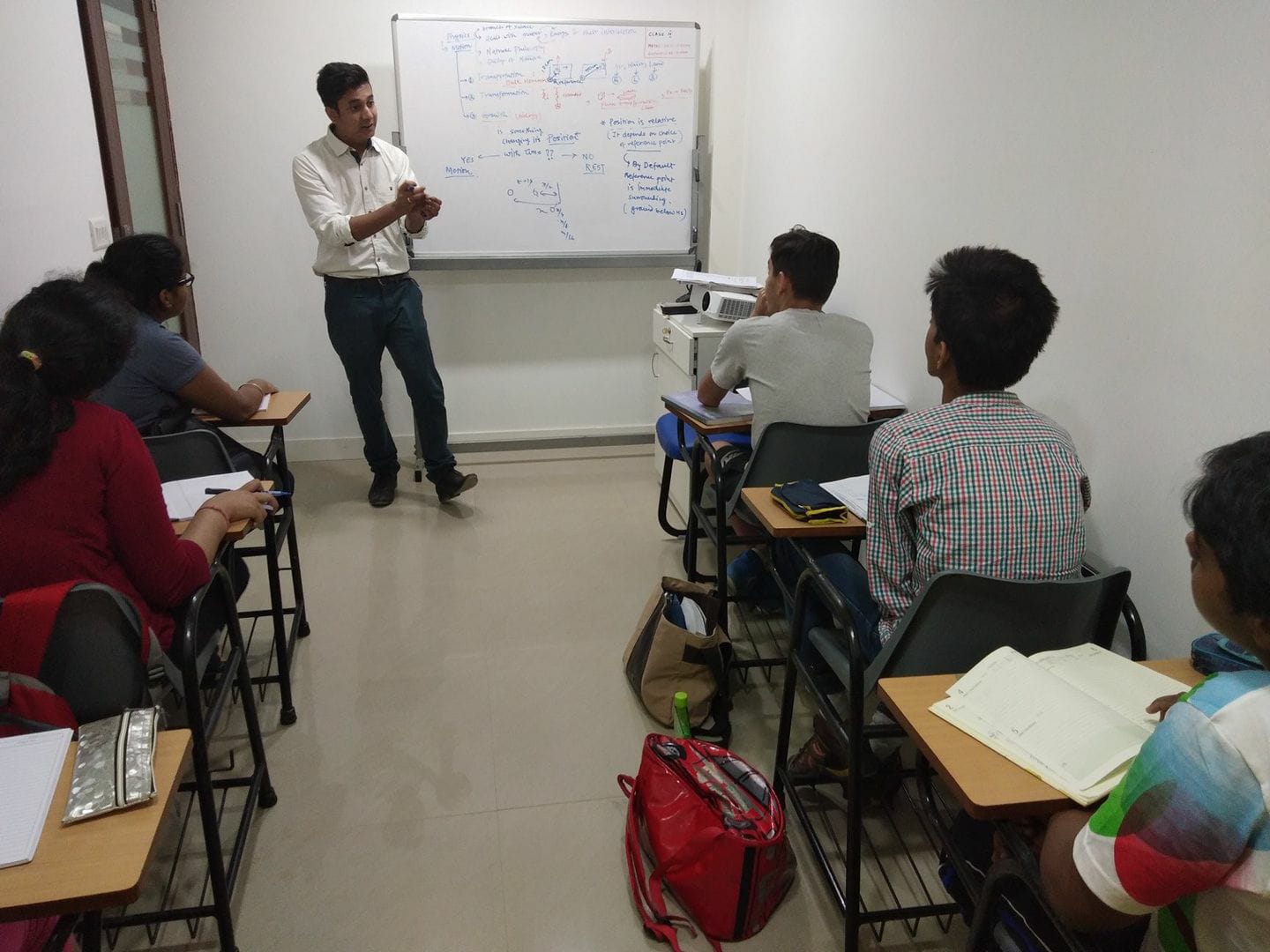 Unloq Minds Tutorials - Class 9 students learning about motion. "Motion ...